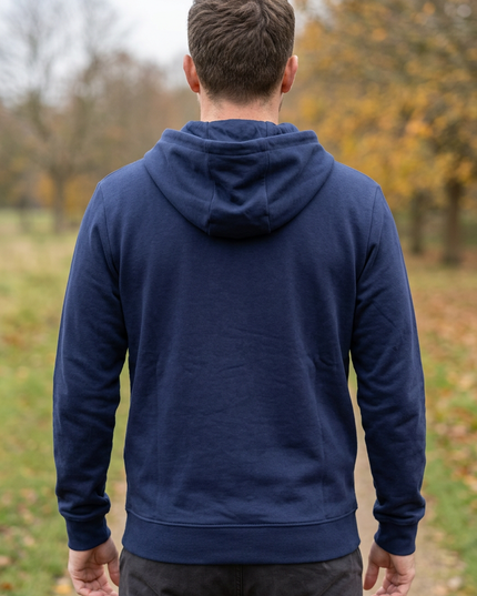 Back view on a white male model in a rural autumn-winter park