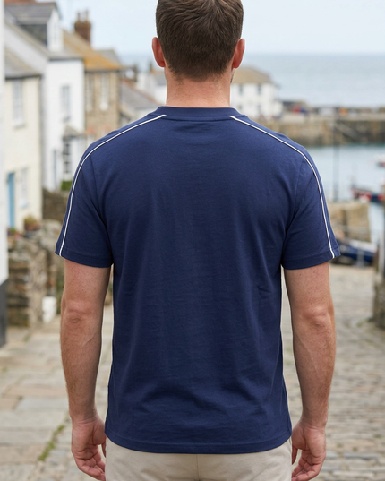 Back view on a white male model in a UK coastal town