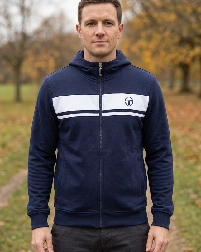 Front view on a white male model in a rural autumn-winter park
