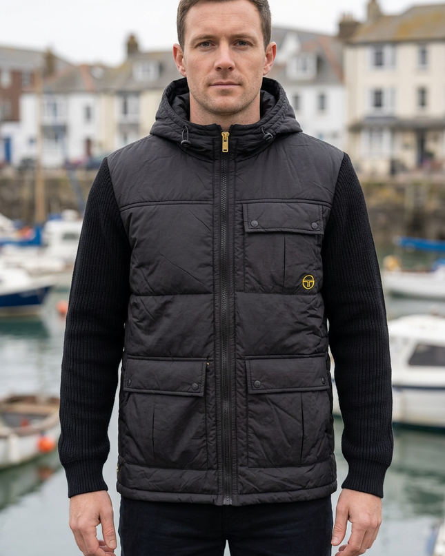 White male model wearing the jacket in an autumn British coastal town